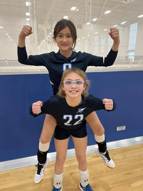 Two volleyball players showing friendship-strong!